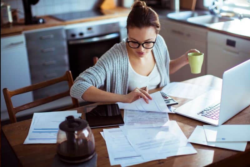a young woman doing her bills