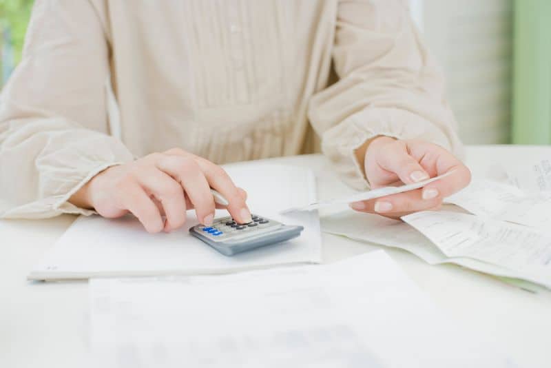 woman using calculator