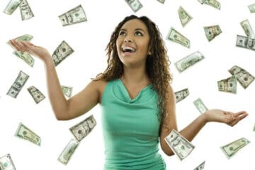 This woman in green is happy because she’s surrounded by money—maybe she earns 8 figures per year!