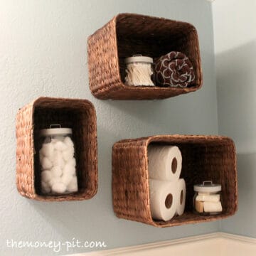 Baskets make great storage shelves when hung on the wall, especially in a bathroom with toilet paper.