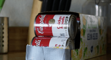 Upcycle a cardboard 12-pack holder into a way to organize soup cans in your pantry. 