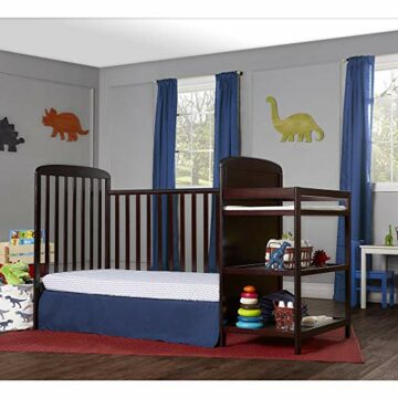 This stylish baby's room with a beautiful dark-colored crib and white walls looks clean and organized thanks to under-crib storage. 