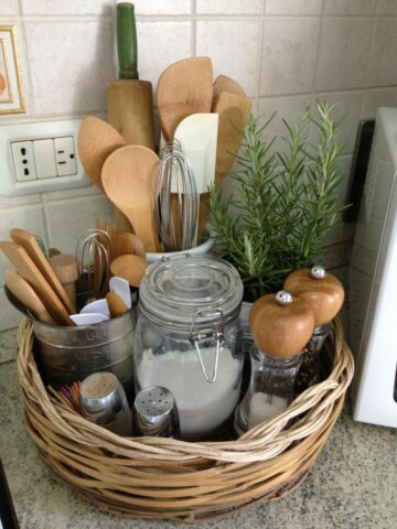 Baskets are a great way to store kitchen utensils, tools, salt and pepper shakers, and more in a small kitchen. 