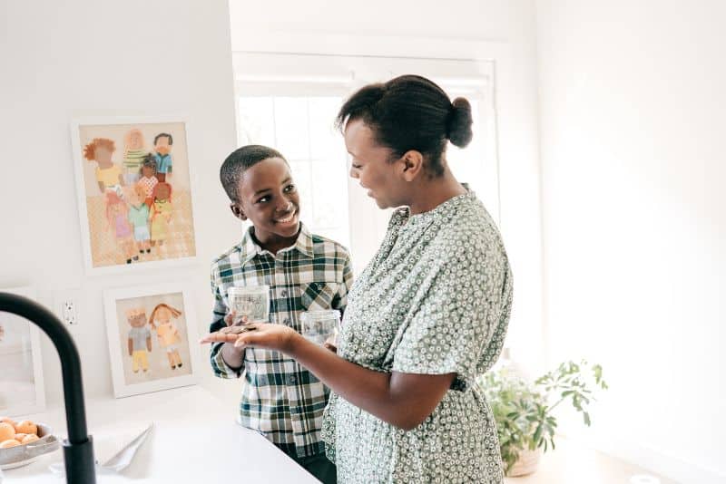 Woman saving money with son.