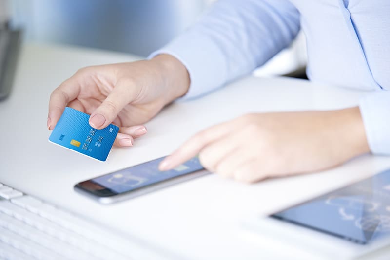 Man using phone to cash a check.