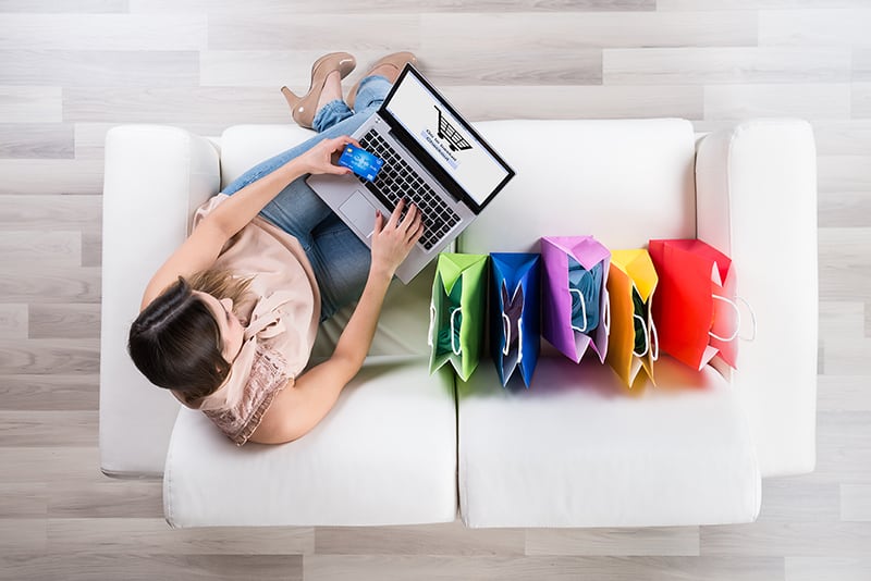 Woman shopping online for a consignment store.