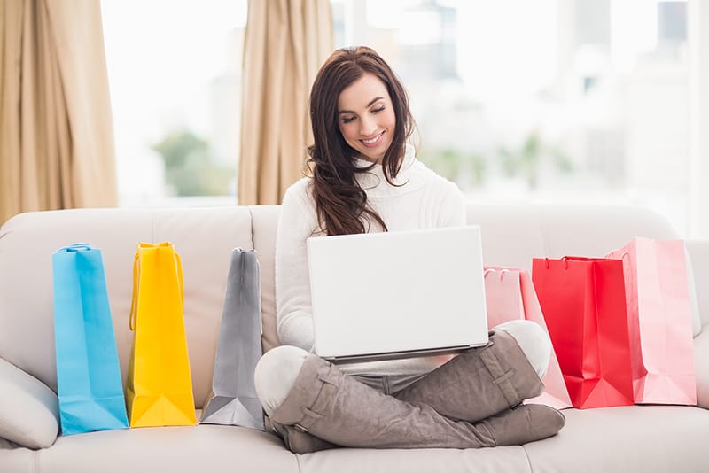 Mom looking online for a consignment shop nearby.