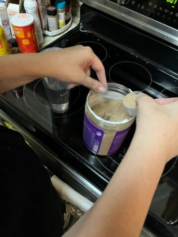 Scooping out protein powder.