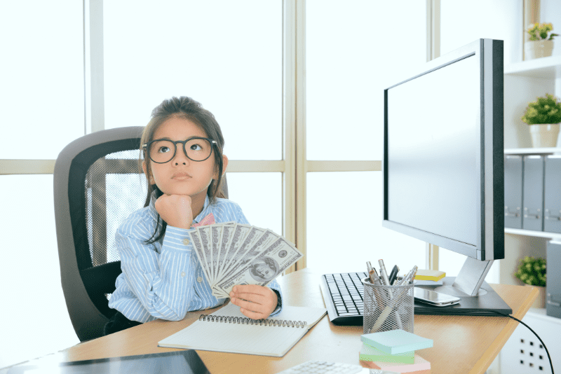 11-Year-Old girl holding cash