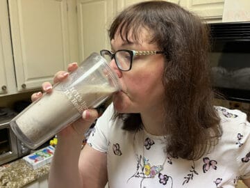 Becky drinking Naked Oats.