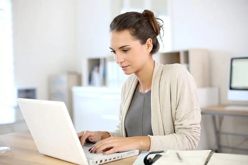 Woman working on her laptop computer.