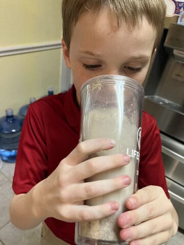 Bryan drinking Naked Oats.