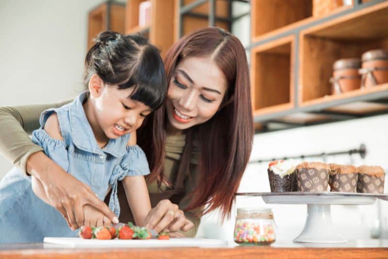 Family cooking at home to save money.