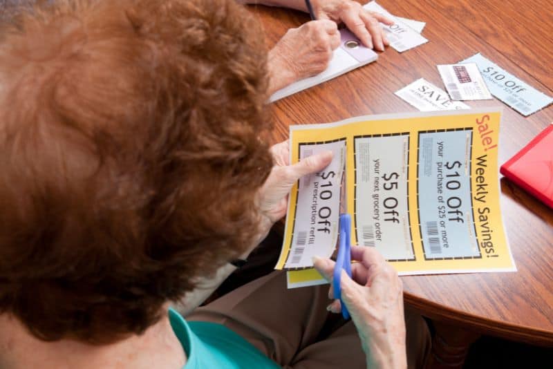 Woman clipping a coupon.