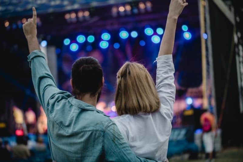 Concert going couple that's having a fun time!