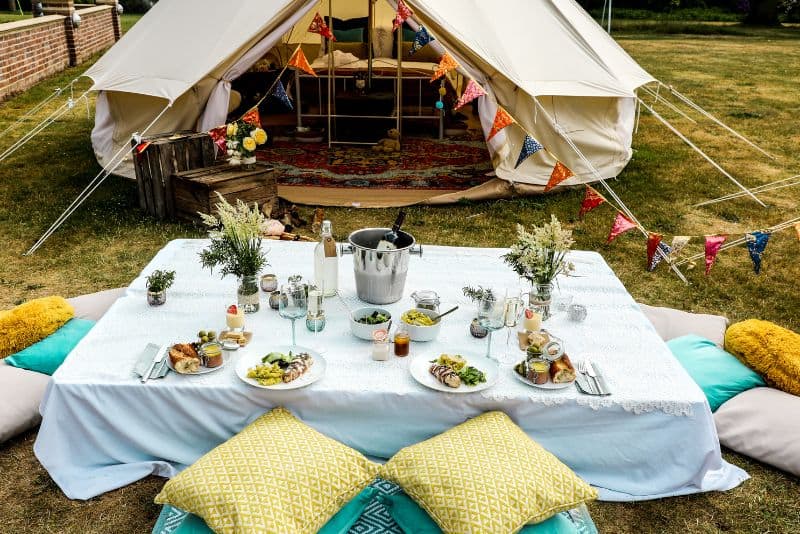 Glamping with a table and food.