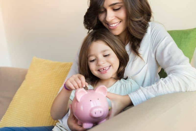 Mom teaching daughter to budget her money.