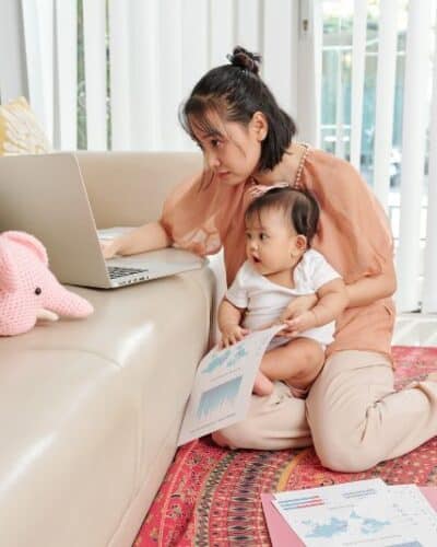 Woman with child going over her credit.