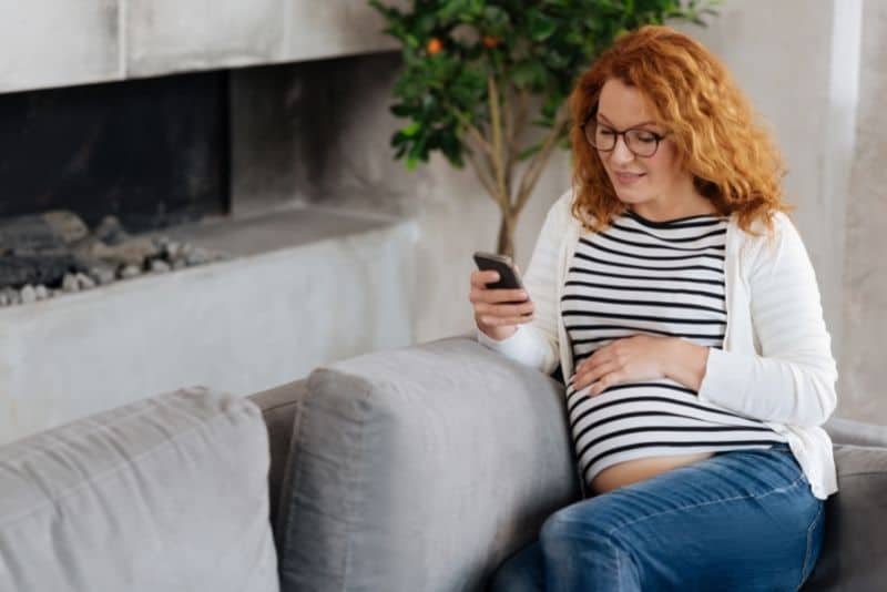 Mom using cash back apps to save money.