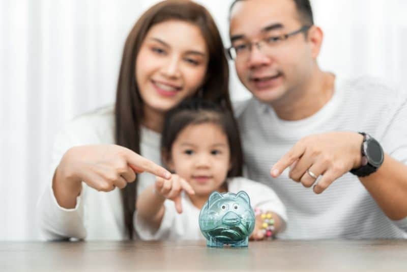Family making a budget together so they save money eating out.