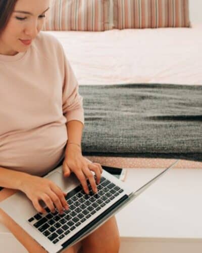 Pregnant woman doing data entry from home.