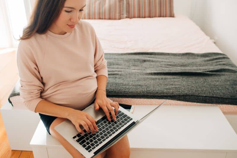 Pregnant woman doing data entry from home.