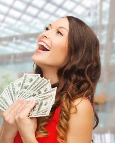 Woman with money and being happy.