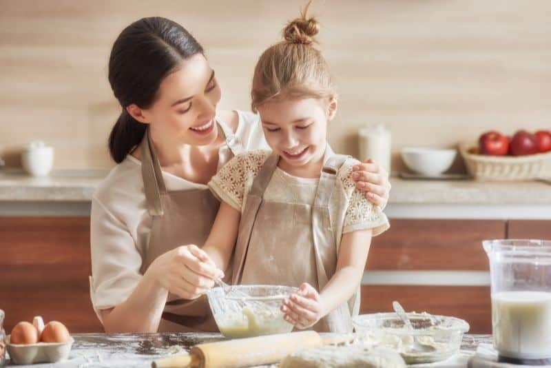 Mother and daughter cooking.