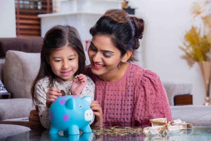 Mom and child saving money after refinancing their home with Own Up.