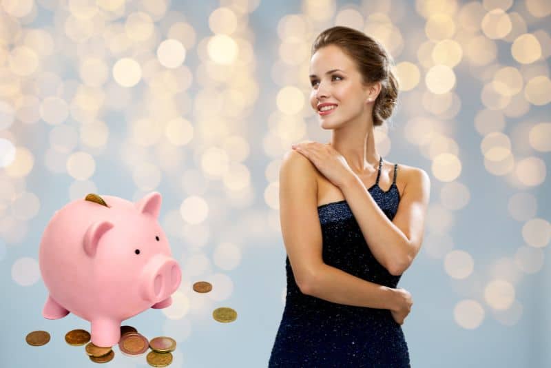 Woman with piggy bank smiling.