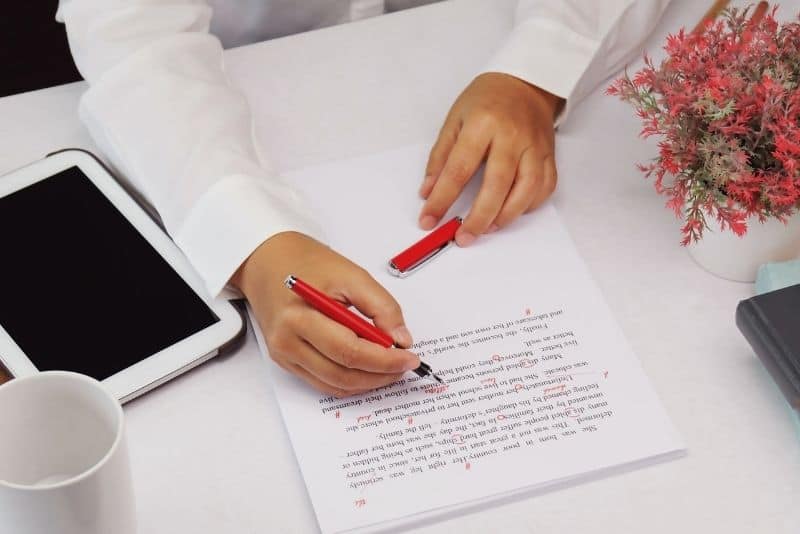 Woman proofreading at home.
