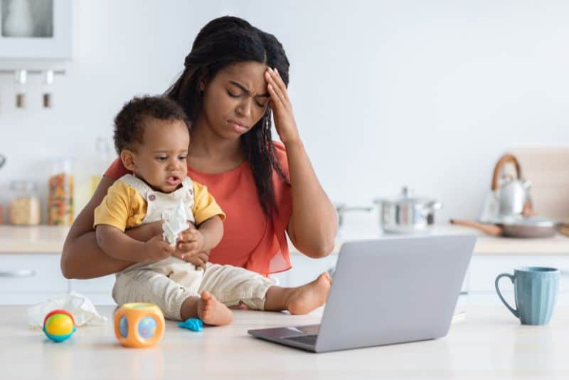 Stressed out mom with her baby.