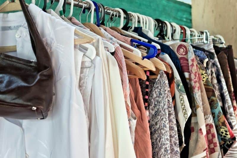 used clothes hanging on a rack