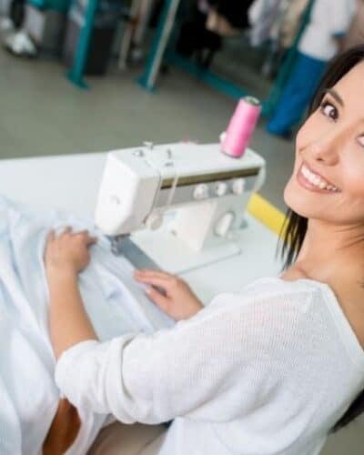 Woman sewing clothes to make money online.