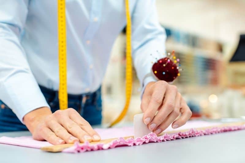 Woman selling alterations online to make money for her family.