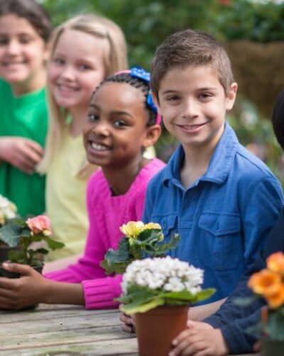 Kids gardening outside.