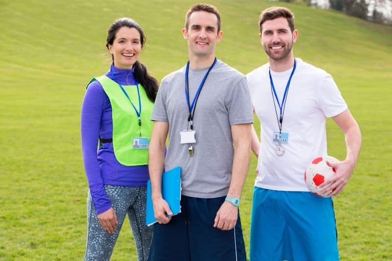 Men and women coaching as a summer job for teachers.
