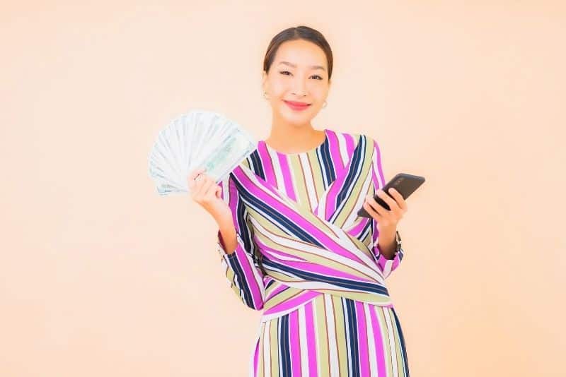 Woman that made money using her phone.