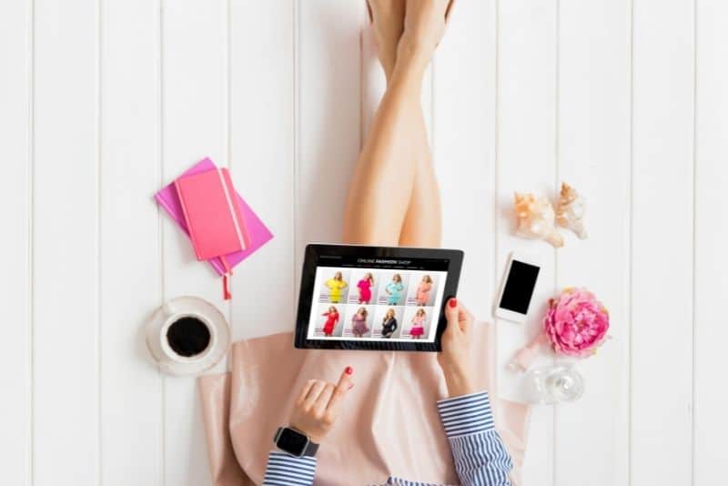Woman shopping on her tablet and making money online.